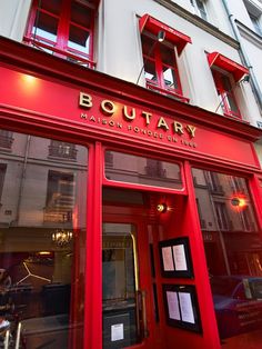 a red building with the words boutary on it's front door and windows