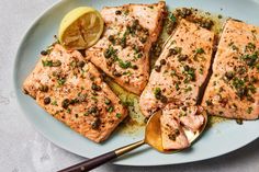 salmon with herbs and lemon on a plate