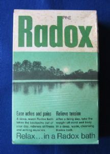 a box of raddox soap sitting on top of a blue cloth