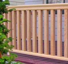 a close up of a wooden rail on a porch