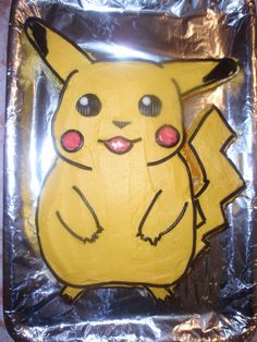 a cake shaped like a pikachu on tin foil