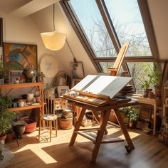 an artist's easel sitting on top of a wooden table in front of a window