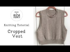 a knitted vest hanging on a wooden hanger with the text knitting tutor chopped vest