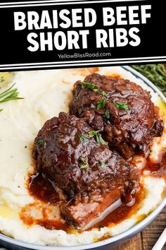 two pieces of braised beef on mashed potatoes with gravy