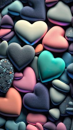 there are many different colored hearts on the rocks together in this photo, and one has a heart shaped cookie