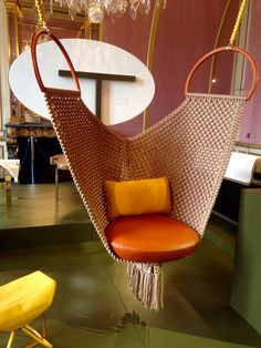 a hanging chair in the shape of a hammock