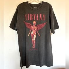 Nirvana In Utero Vintage Black Tee Shirt Faded Black T Shirt That Features Nirvanas Logo. Printed On A Washed Down Soft Garment - Washed 100% Cotton In A Relaxed Fit. Crew Neck Short Sleeves Brand New Officially Licensed Nirvana Vintage Black T Shirt Size Small Chest 18” Length 26” Size Medium Chest 20” Length 28” Size Large Chest 22” Length 29” Nirvana In Utero Vintage Black Graphic Tee Shirt Alex Core, Nirvana Logo, Nirvana In Utero, Nirvana Shirt, In Utero, Black Graphic Tee, Black Tee Shirt, Black Graphic Tees, Graphic Tee Shirt