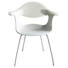 a white plastic chair sitting on top of a metal frame stand with legs and arms