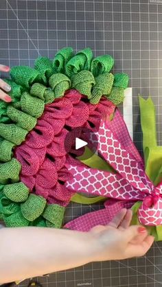 someone is making a wreath out of fabric