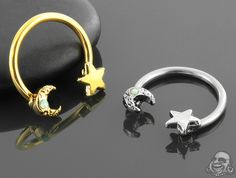 two different types of rings with stars and moon designs on the front, one in gold or silver