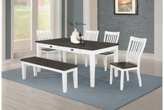 a dining room table with four chairs and a bench