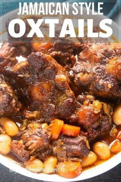 jamaican style oxtails with beans and carrots in a white bowl on a table