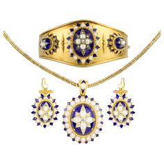 A mid-Victorian half pearl, diamond and blue enamel suite, the suite consisting of a necklace, a bracelet and a pair of earrings, each set to the centre with an old cut diamond surrounded by four half-pearls, embellished with rose-cut diamonds on blue enamel dome, surrounded by a cluster of half pearls within blue-enamel border, all set to yellow gold mount, the necklace suspended by snake chain with half-pearl and enamel clasp, the matching bracelet with gold cuff fitting, in fitted cases by Ho Smoky Quartz Necklace, Tudor Style, Victorian Gold, Enamel Necklaces, Jewellery Shop, Gold Cuffs, Modern Necklaces, Bespoke Jewellery, Victorian Jewelry