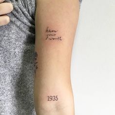 a woman's arm with a tattoo that reads, born in june 1939 on it