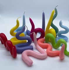 several colorful candles are arranged in the shape of letters that spell out numbers on them