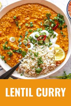 lentil curry in a bowl with rice and garnish