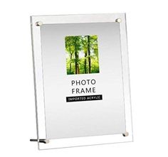 a white frame with an image of trees in the background and text that reads photo frame