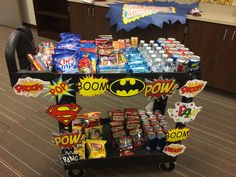 a cart filled with snacks and drinks on top of a carpeted floor