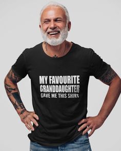 an older man wearing a t - shirt that says, my favorite granddaughter gave me this shirt