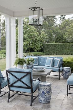 an outdoor patio with blue and white furniture