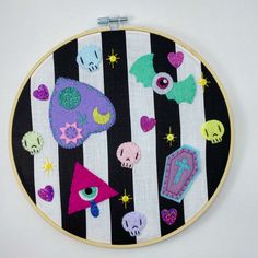 I made this fun flash art wall hanging using cotton fabric as the background and wool blend and glitter and acrylic felt and sequins for the details. inside a bamboo hoop.  Measures 9" Goth Flash Art, Felt Wall Decor, Art Flash, Felt Wall Hanging, Felt Wall, Pastel Decor, Flash Art, Creepy Cute, Hoop Art