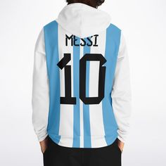 Sports fans will love this Messi Hoodie, based on the iconic Argentina Soccer Jersey N. 10. It's a stylish way to show your support for one of the greatest soccer players of all time. This fashionable hoodie offers a comfortable fit with long-lasting durability for everyday wear. • 20% cotton, 75% polyester, 5% spandex• Unisex fit• Soft cotton hand-feel fabric surface• Brushed fleece fabric on the inside• High definition printing colours• Double layer hood• Kangaroo pocket Shipping from China (a Sporty Hoodie For Sports Events, Sporty Fleece Hoodie For Fans, Crew Neck Hoodie For Sports Events, White Hoodie With Team Logo For Fans, Team Spirit Hoodie With Graphic Print, Sports Season Fan Merchandise Hoodie With Letter Print, Sporty Hoodie With Letter Print For Fans, Sports Fan Hoodie With Long Sleeves, White Hoodie For Sports In Fan Apparel Style