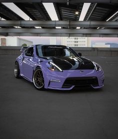 a purple sports car parked in a parking garage