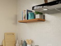 a stove top oven sitting inside of a kitchen next to a wall mounted range hood