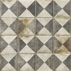 an old tile wall with grey and white squares