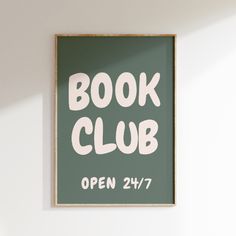 a green book club sign hanging on the wall