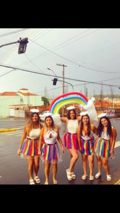 the girls are dressed in rainbow outfits