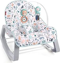 a baby rocking chair with a teddy bear on the front and back seat in blue, pink