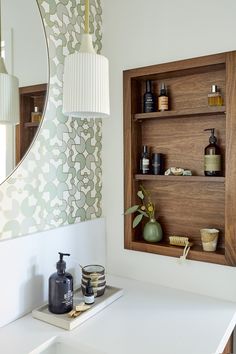 the bathroom is clean and ready to be used as a storage area for personal care items