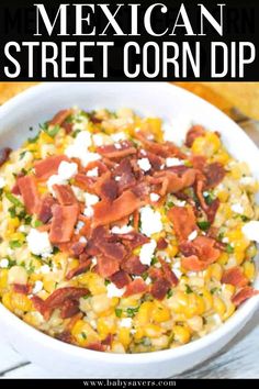 mexican street corn dip in a white bowl with bacon and feta cheese on top