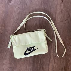 Snap Enclosure, Multiple Compartments, And Nike Details All Over. Dimensions Are Roughly 9” X 6”. Comes With A Zipper Pocket. Unworn But Has Some Dust/Light Staining On The Back (See Last Pic). Could Probably Be Treated To Remove. Good Condition Otherwise! Nike School Bag With Adjustable Strap, Nike Shoulder Bag For School, Nike Rectangular Everyday Bags, Nike Shoulder School Bag, Nike White Everyday Bags, Everyday Nike Rectangular Shoulder Bag, Nike Everyday Rectangular Shoulder Bag, Rectangular Nike Shoulder Bag, Trendy Nike Travel Bag