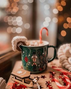 a christmas mug with candy canes and decorations