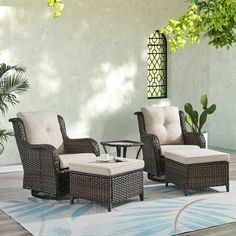 an outdoor patio with wicker furniture and potted plants