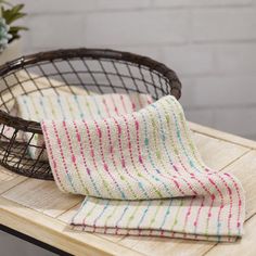 a table with a basket and towel on it