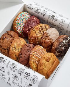 a box filled with lots of different types of cookies