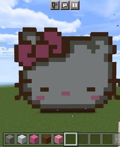 an image of a hello kitty in minecraft with the sky and clouds behind it