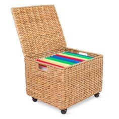 a wicker storage box on wheels with colored folders in the bottom drawer and lid