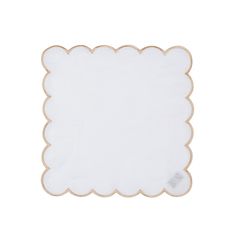 a white napkin with scalloped edges is shown on a white surface and has gold trim around the edge