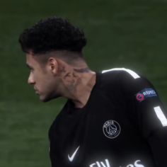 a soccer player with tattoos on his face