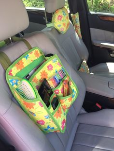 the back seat of a car with an organizer in it's center console compartment