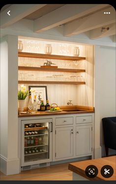 a kitchen with white cabinets and wood counter tops is shown in this image, the light shines on the shelves above the sink