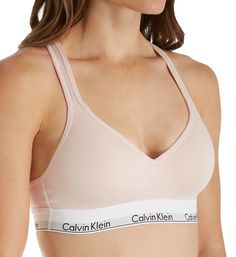 Highly sought after, highly comfortable bra with instantly recognizable Calvin Klein logos and push-up padding for a flattering lift. Made of cotton, modal, polyester and elastane. Wireless, contour/t-shirt cup has a medium graduated push-up bump ridge along bottom and side for enhanced cleavage. Cotton-blend cup overlay has a soft, smooth finish. Flattering neckline with a tall center front. Exposed elastic Calvin Klein underband secures fit and lends light support. Sides and back are self-line Medium Support Push-up Sports Bra, Fitted Seamless Calvin Klein Bra, Calvin Klein Seamless Fitted Bra, Calvin Klein Fitted Seamless Bra, Calvin Klein Stretch Seamless Sports Bra, Calvin Klein Underwire Bra With Padded Cups, Calvin Klein Seamless Bra, Padded Sports Bra In Solid Color, Calvin Klein Seamless Sports Bra With Medium Support