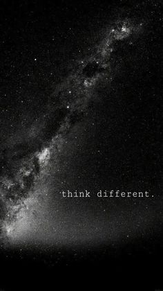 a black and white photo with the words think different in front of a night sky