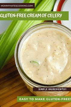 a jar filled with cream and celery sitting on top of a wooden cutting board