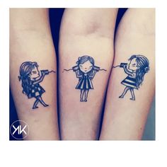 two girls with tattoos on their arms are holding hands and looking at the same direction