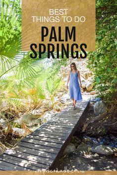 a woman walking across a wooden bridge in the woods with text overlay saying best things to do palm springs